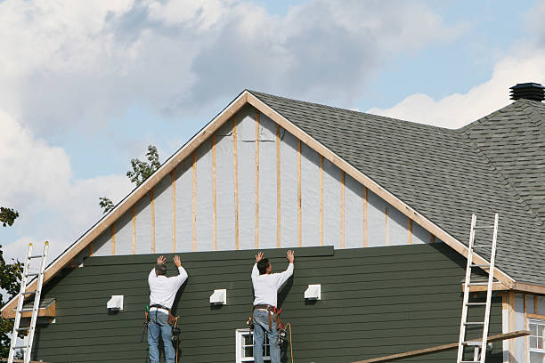 Professional Siding technician working in Hampton, MD